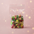Assortiment Bonbons Lisses 400g fond rose bokeh